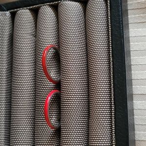 Two red enamel bands.